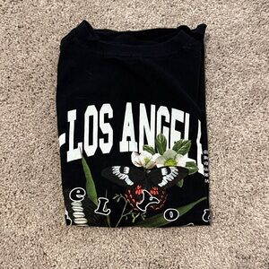 Black Graphic T-Shirt with Floral and Butterfly Design